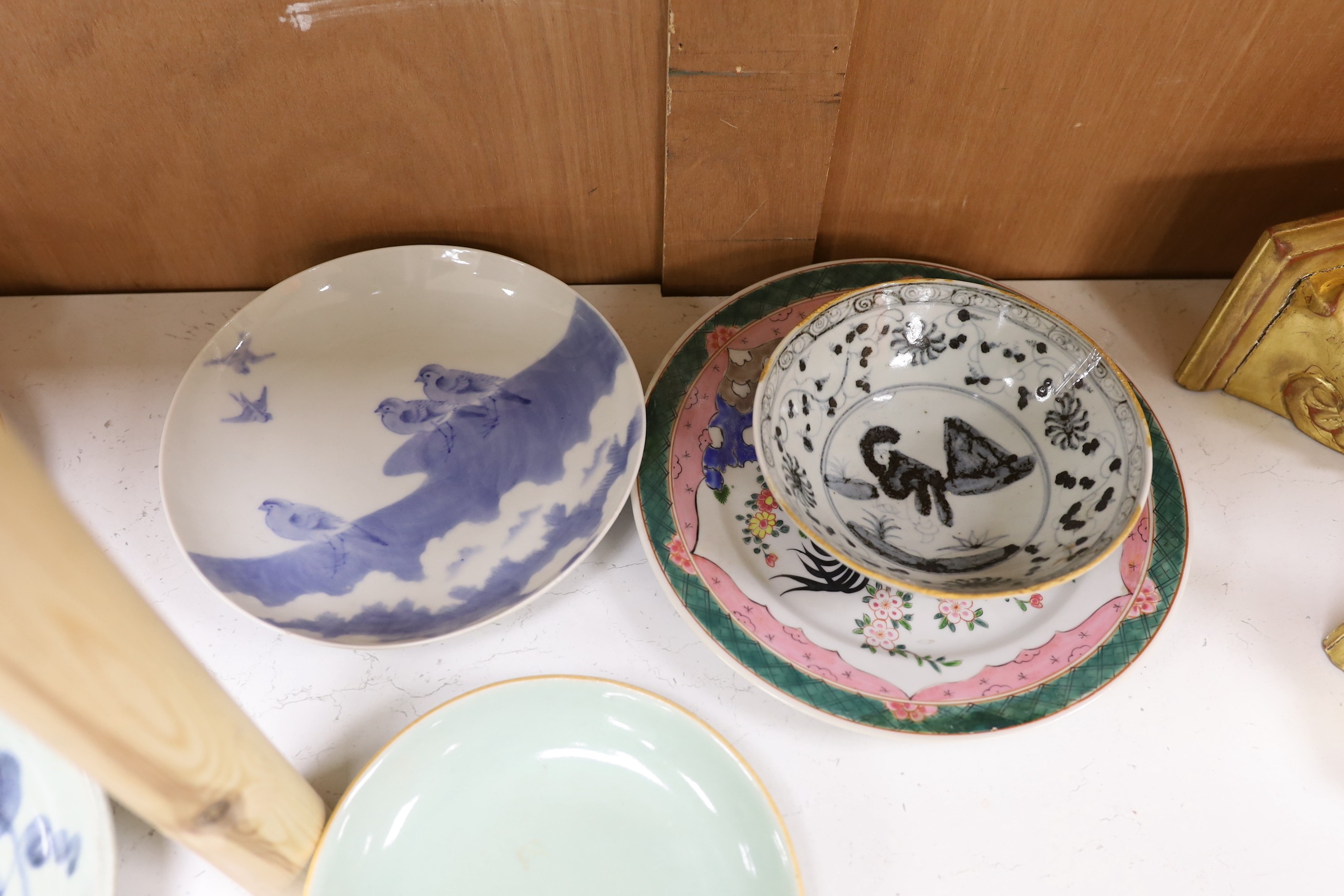 A group of Chinese plates and dishes including a Ming dynasty blue and white bowl